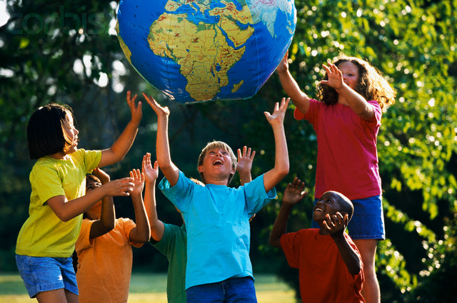 Children Playing with Globe --- Image by © Ariel Skelley/CORBIS